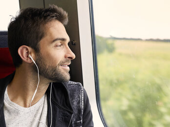 Handsome,Dude,On,Train,Listening,To,Music
